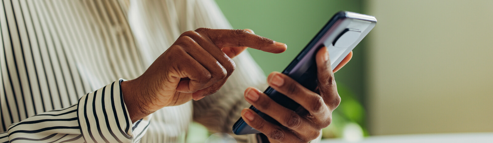 close-up of a person's hands holding a smartphone